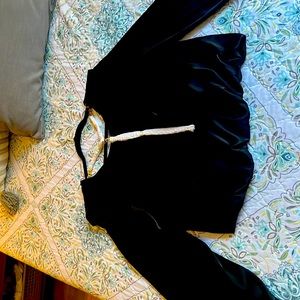 Beautiful blouse in black with tag I nice design chain in the back looks nice